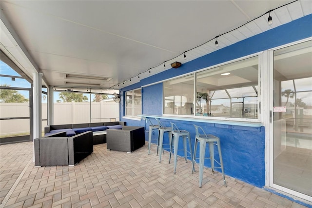 view of patio / terrace with exterior bar and an outdoor hangout area