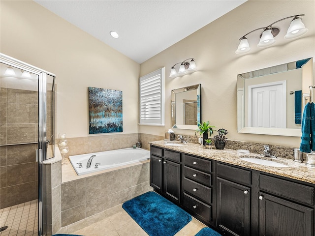 bathroom featuring tile patterned floors, vanity, lofted ceiling, and shower with separate bathtub