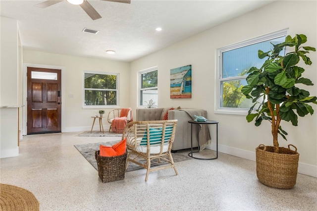 sitting room with ceiling fan