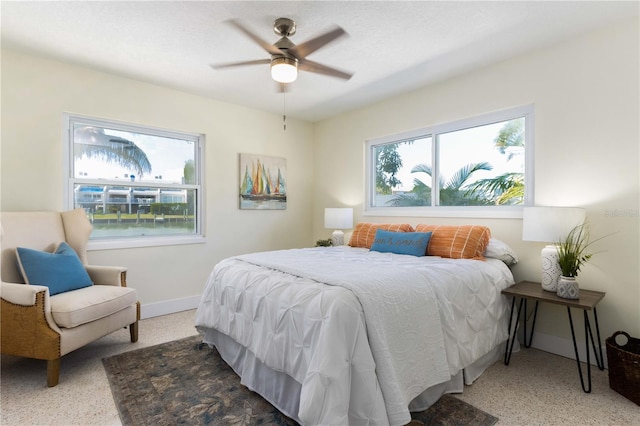 bedroom with ceiling fan and carpet