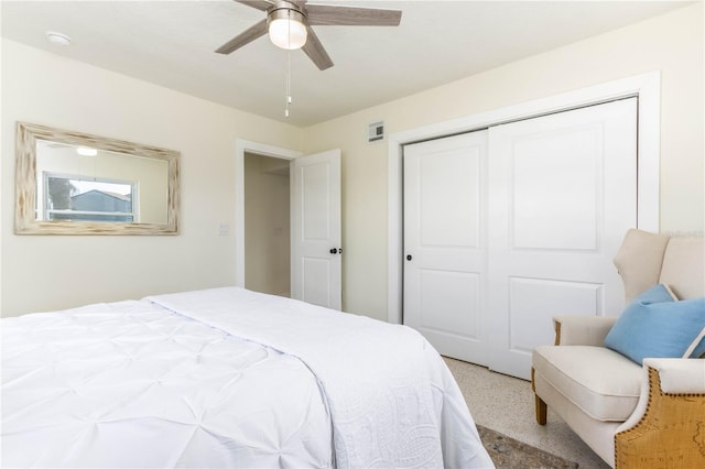 bedroom featuring ceiling fan and a closet