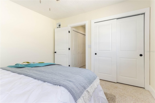 bedroom featuring a textured ceiling