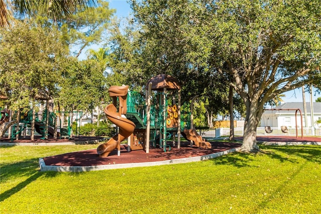 view of playground with a lawn