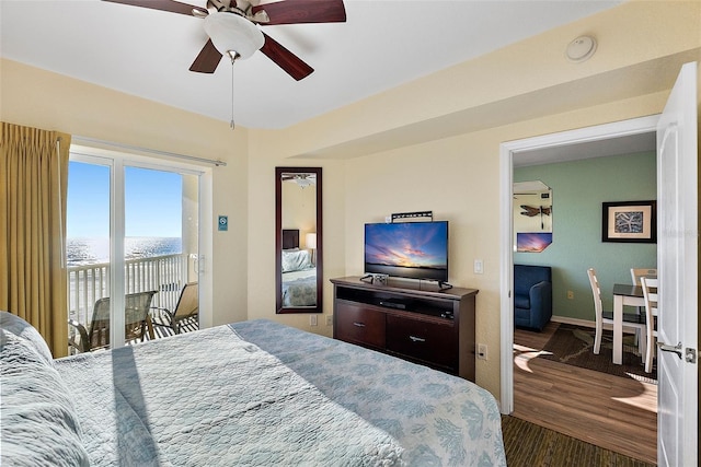 bedroom featuring ceiling fan, dark hardwood / wood-style flooring, and access to outside