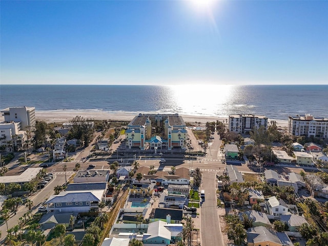 bird's eye view featuring a view of the beach and a water view