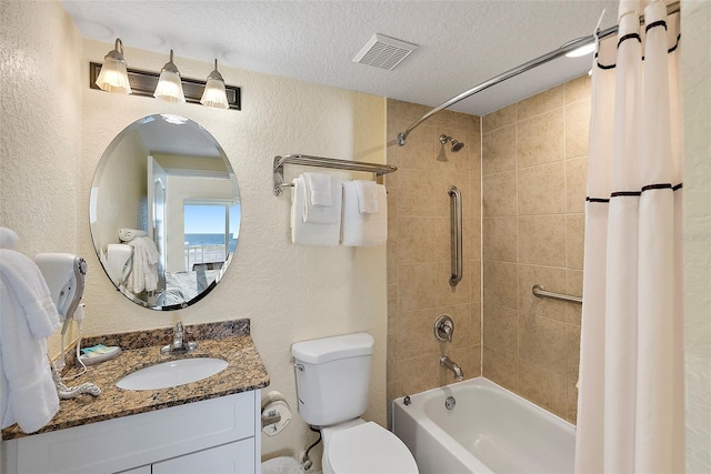 full bathroom with vanity, toilet, shower / bathtub combination with curtain, and a textured ceiling