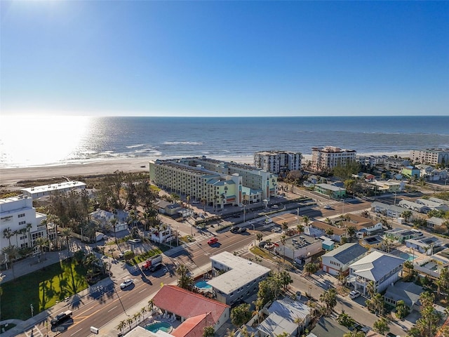 birds eye view of property featuring a beach view and a water view