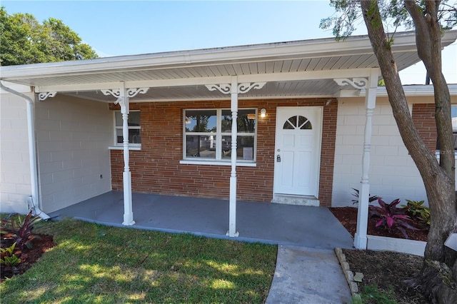 doorway to property featuring a porch