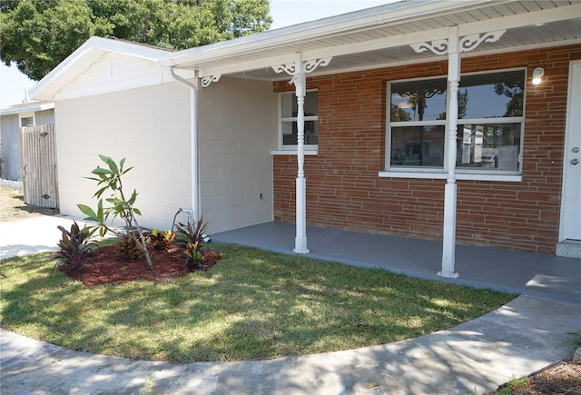 exterior space with a front lawn and covered porch