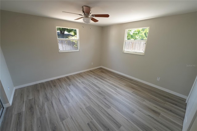 empty room featuring light hardwood / wood-style flooring and ceiling fan