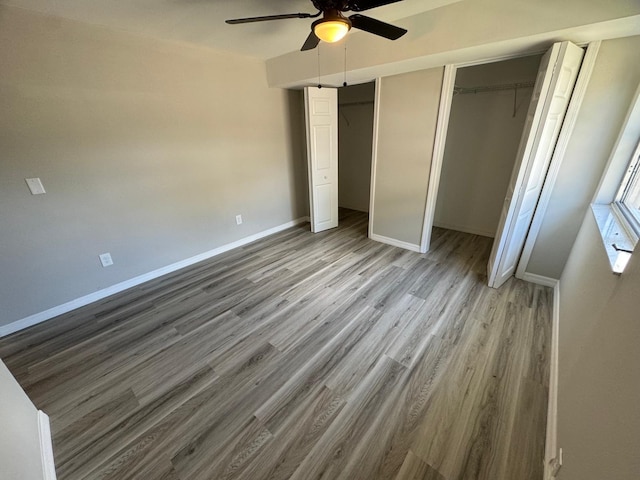 unfurnished bedroom featuring ceiling fan and wood-type flooring