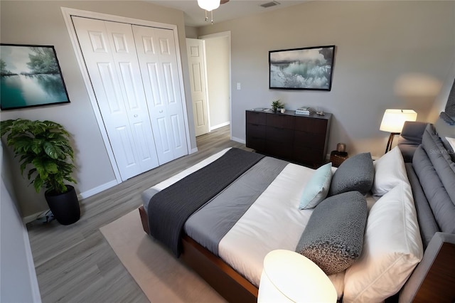 bedroom featuring hardwood / wood-style flooring and a closet