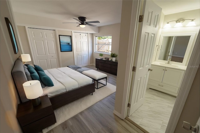 bedroom with ceiling fan and light hardwood / wood-style floors