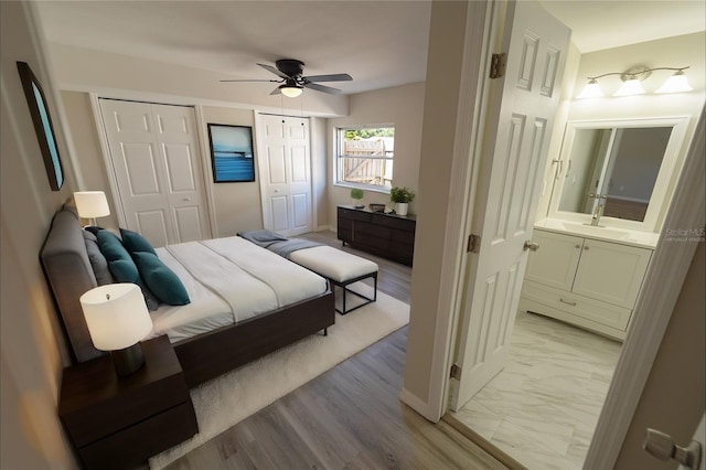 bedroom with marble finish floor and a ceiling fan