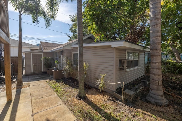 view of front of home featuring a storage shed