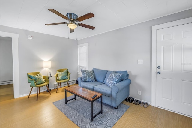 living room with ceiling fan, light hardwood / wood-style flooring, and a baseboard radiator