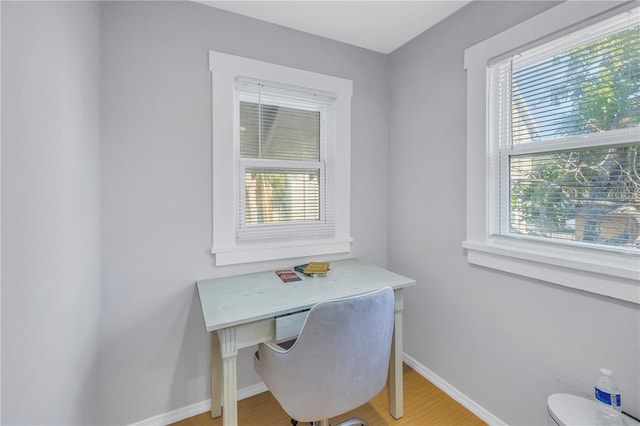 office area featuring hardwood / wood-style floors and a healthy amount of sunlight