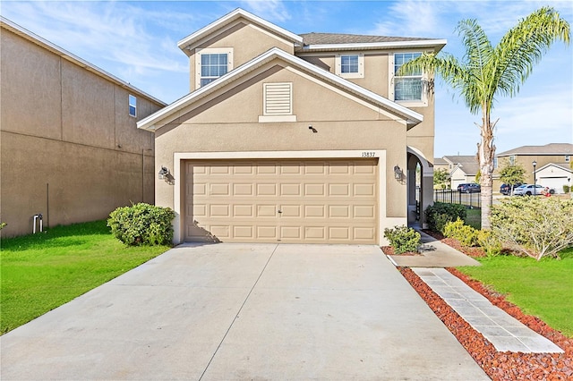 view of front of house featuring a front yard and a garage