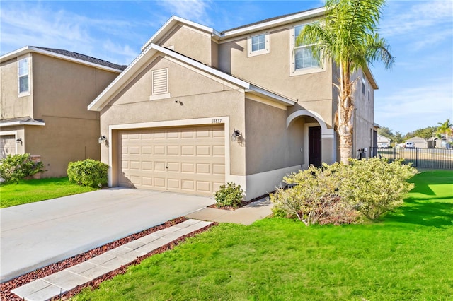 view of front facade featuring a front yard and a garage