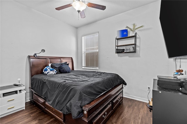 bedroom with ceiling fan and dark wood-type flooring