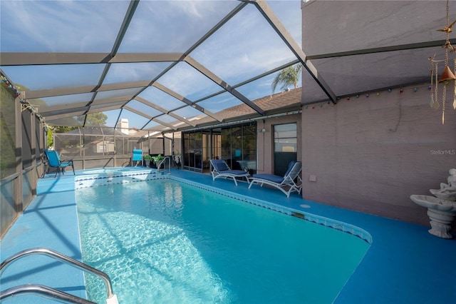 view of pool featuring a patio area and a lanai