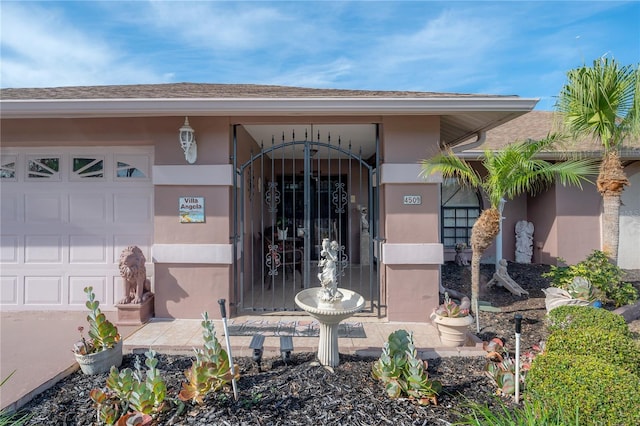 view of exterior entry featuring a garage