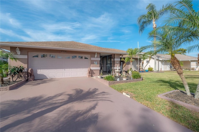 single story home with a front yard and a garage