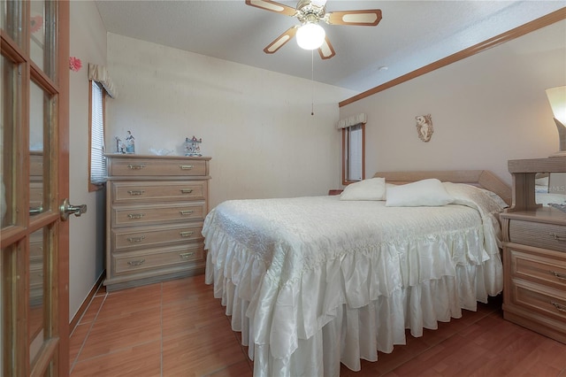 bedroom with ceiling fan and light hardwood / wood-style floors