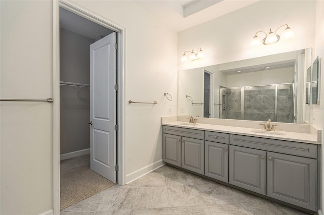 bathroom featuring vanity and an enclosed shower