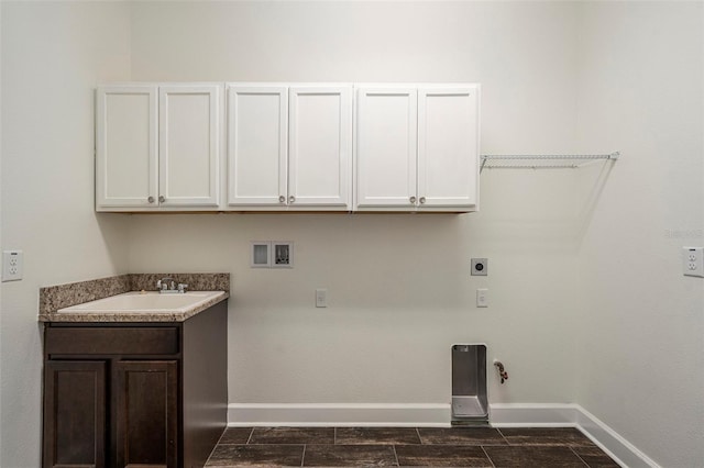 laundry room with sink, cabinets, electric dryer hookup, hookup for a gas dryer, and hookup for a washing machine