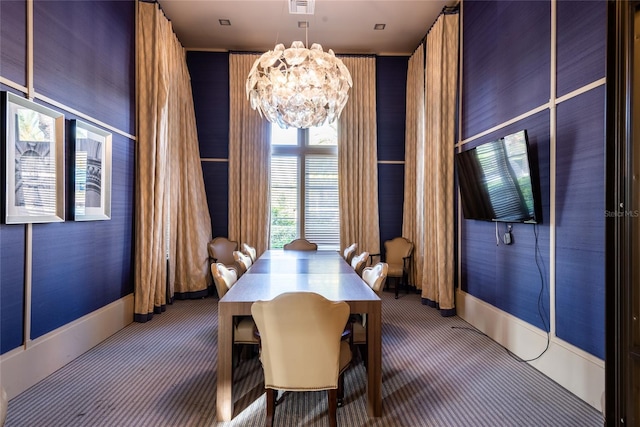 unfurnished dining area featuring carpet floors and an inviting chandelier