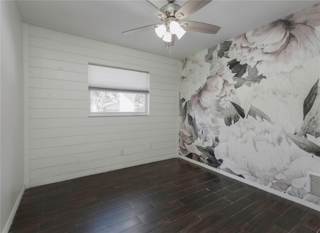 unfurnished room with dark hardwood / wood-style flooring