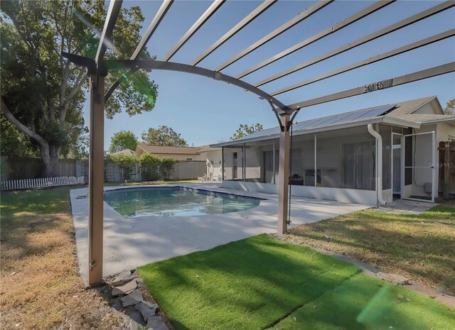 view of pool with a yard and a patio area