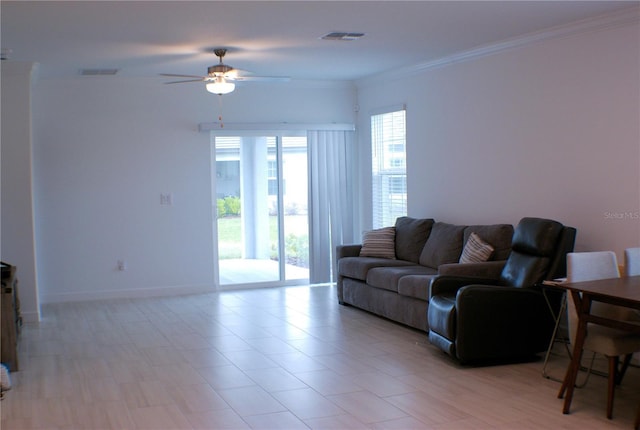 living room with ceiling fan and ornamental molding