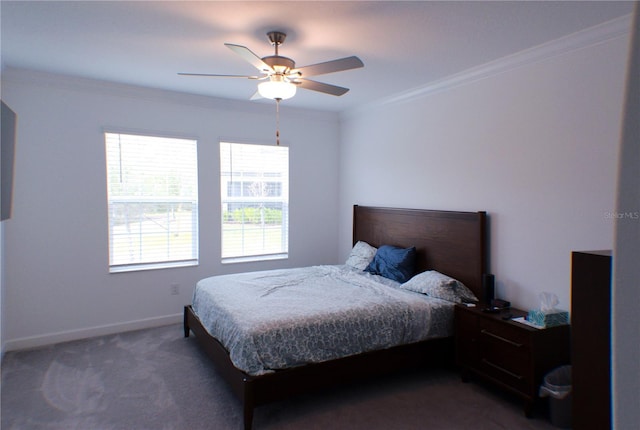 bedroom with ceiling fan, dark carpet, and crown molding