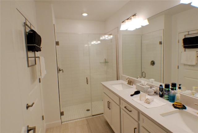 bathroom with vanity and an enclosed shower