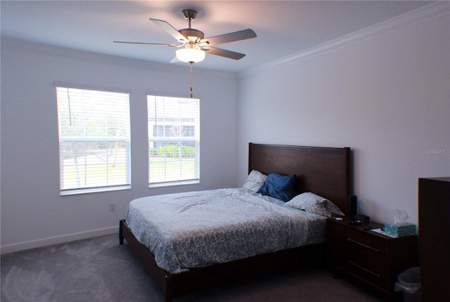 bedroom with dark colored carpet, ceiling fan, and crown molding