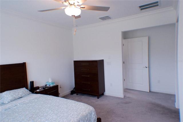 carpeted bedroom featuring ceiling fan and ornamental molding