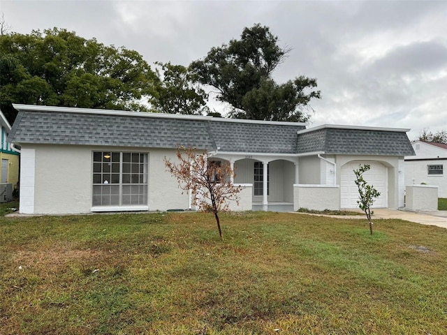 ranch-style house with a front yard and a garage