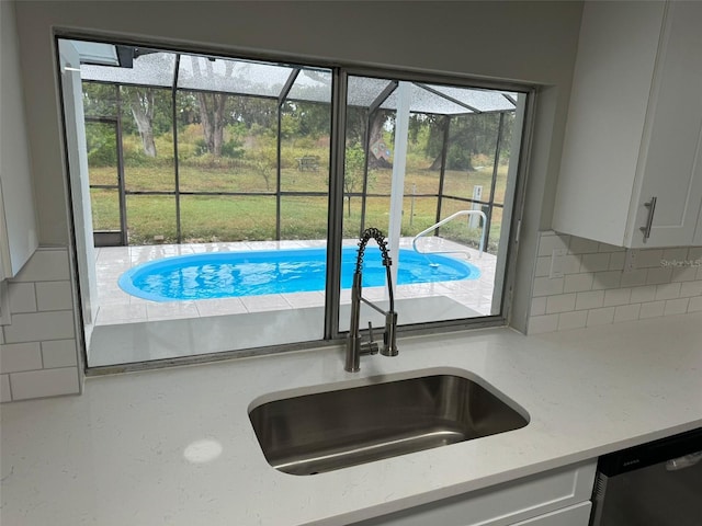 view of pool featuring sink