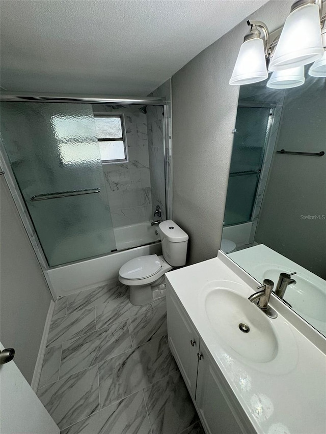 full bathroom featuring shower / bath combination with glass door, vanity, a textured ceiling, and toilet