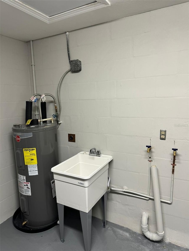 utility room featuring electric water heater