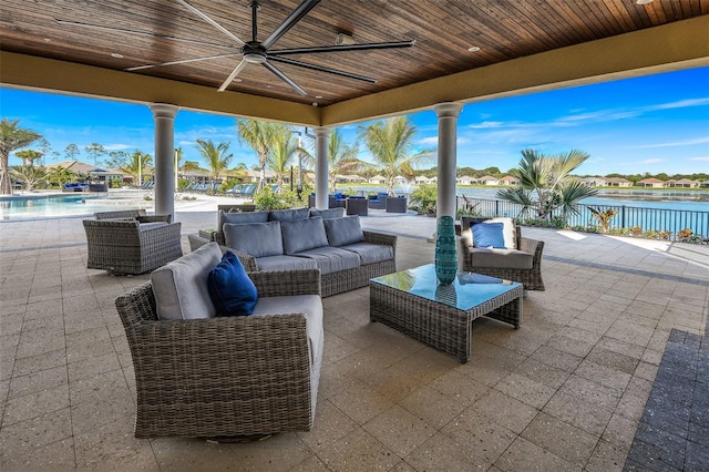 view of patio / terrace with a water view and an outdoor hangout area