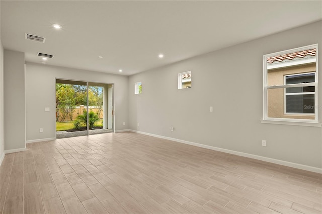 empty room with light wood-type flooring