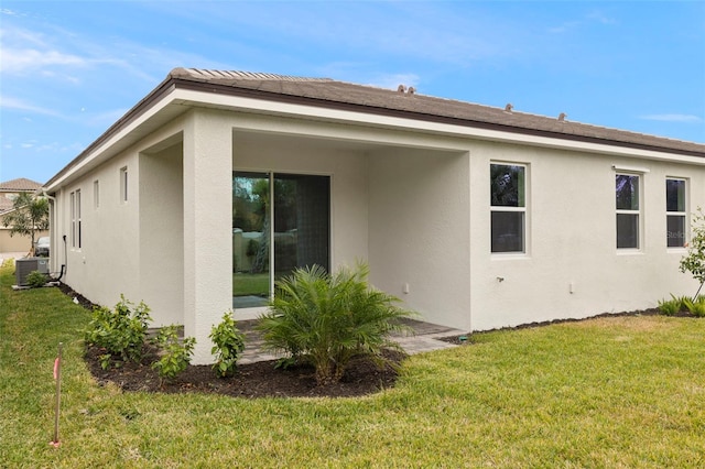 view of property exterior featuring a lawn