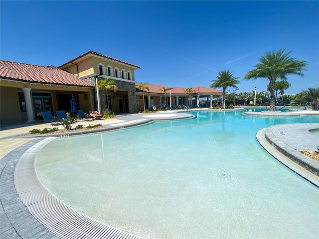 view of swimming pool featuring a patio area