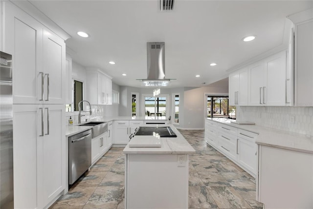 kitchen with dishwasher, kitchen peninsula, sink, range hood, and white cabinetry