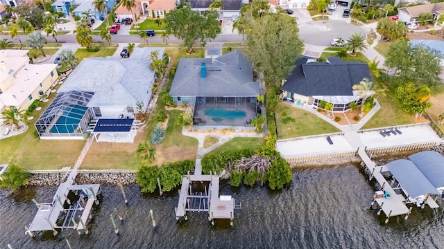 birds eye view of property with a water view