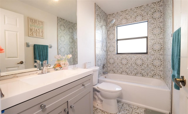 full bathroom with vanity, toilet, and tiled shower / bath