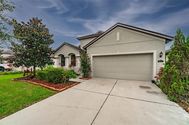 view of front of house featuring a garage and a front yard